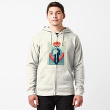 Person in a grey zipped up hoodie with Shepard Fairey's artwork